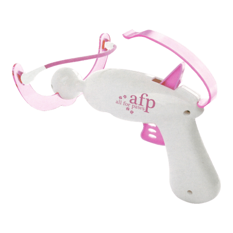 Close-up of crossbow cat toy launching soft yarn balls