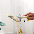 Image of cat litter falling through 2 in 1 Metal Litter Scoop - Pets Villa. 