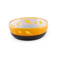 Pink plastic cat food or water bowl with heart-shaped cutout design