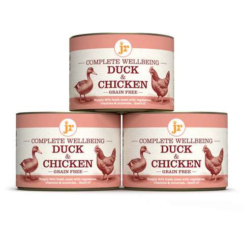 Image of cans of JR Dog Complete Wellbeing Duck & Chicken 200g stacked - Pets Villa. 