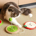 Image of a cat playing with MARTINA Fruit Sisal Cat Scratching Plate and Ball - Pets Villa. 