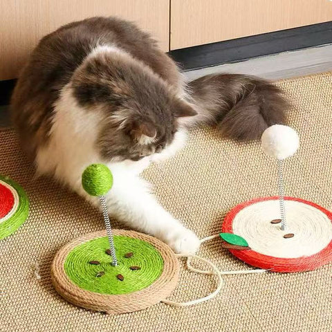 Image of a cat playing with MARTINA Fruit Sisal Cat Scratching Plate and Ball - Pets Villa. 