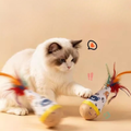 Image of a cat playing with Wooden Wobble Feather Cat Toy - Pets Villa. 