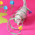 Image of a cat going through ZEZE Funny Spring Tunnel Toy - Pets Villa. 