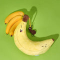 Close up next to a banana of ZEZE Softer Banana Pet Pillow - Pets Villa. 