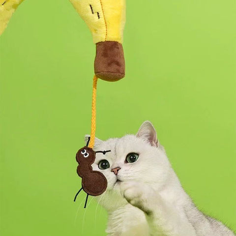 Close up image of cat swatting at ZEZE Softer Banana Pet Pillow - Pets Villa. 