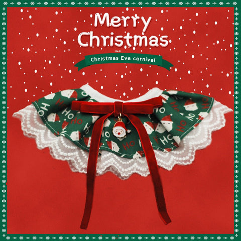 Small dog wearing red plaid Christmas scarf with festive bow